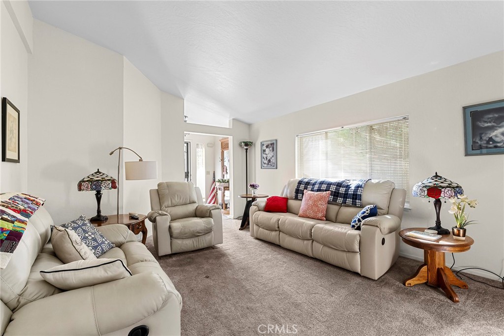 2050 Springfield Drive, Unit 323 Chico, CA 95928 - Photo 2 of 43 a living room with furniture and a window
