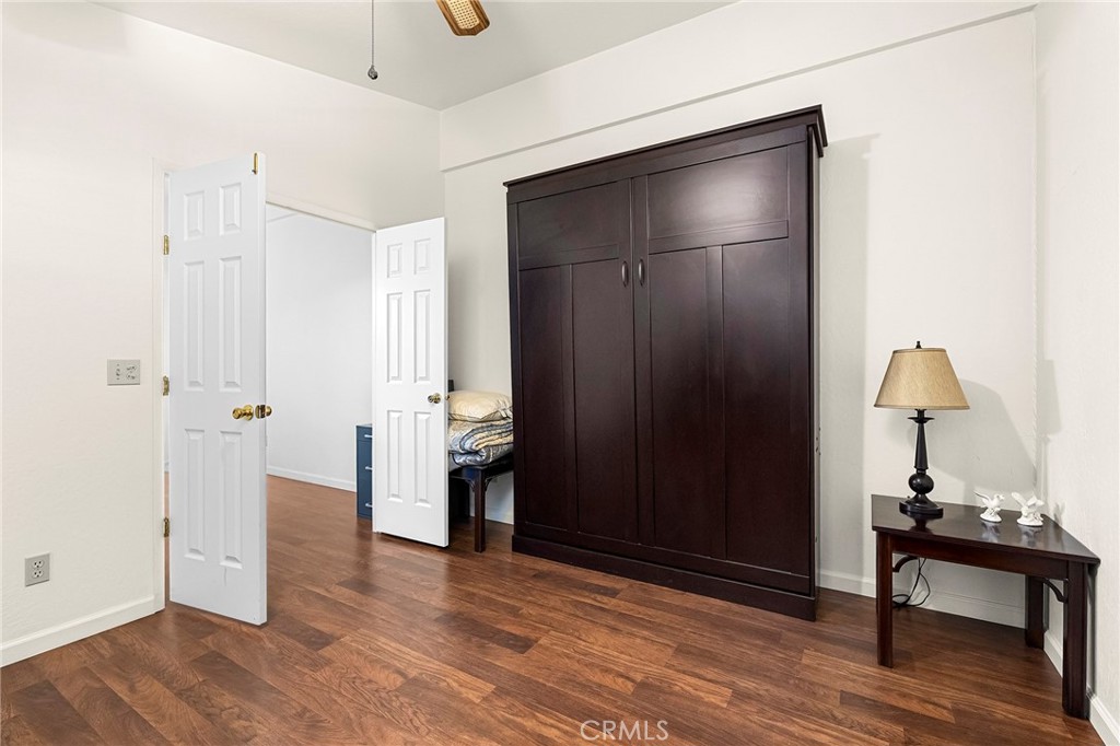 2050 Springfield Drive, Unit 323 Chico, CA 95928 - Photo 23 of 43 a view of a livingroom with wooden floor and a bathroom