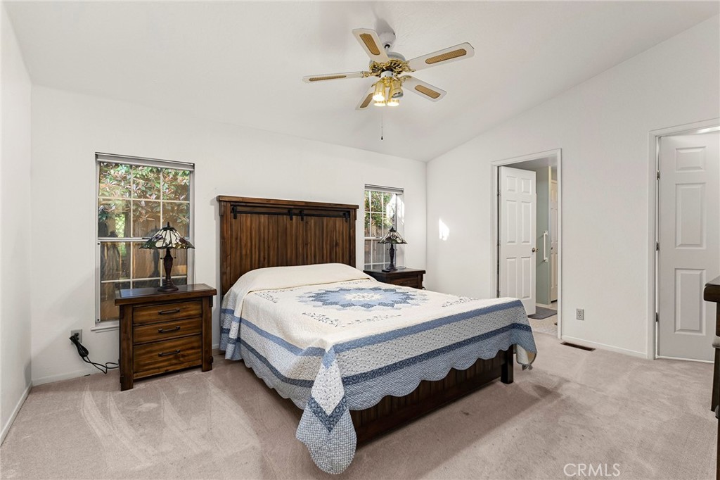 2050 Springfield Drive, Unit 323 Chico, CA 95928 - Photo 28 of 43 a bed sitting in a spacious bedroom