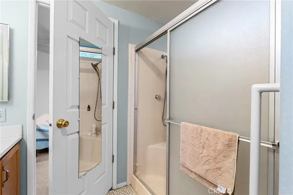 a bathroom with a shower and a tub