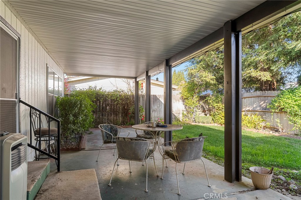 2050 Springfield Drive, Unit 323 Chico, CA 95928 - Photo 35 of 43 a patio with yard table and chairs