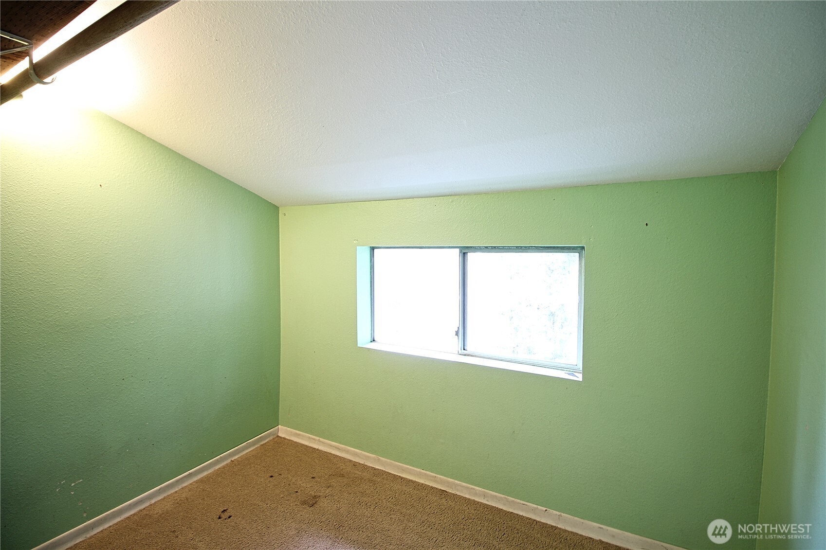 126 East 64th Street Tacoma, WA 98404 - Photo 13 of 36 a small space with a window and a fan
