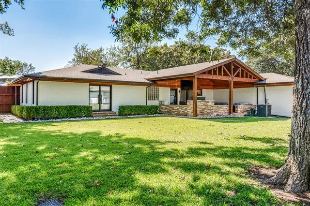 a front view of a house with swimming pool