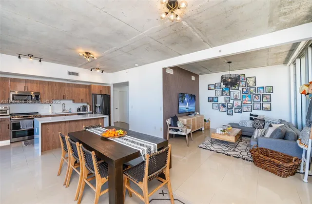a outdoor dining space with furniture and kitchen view