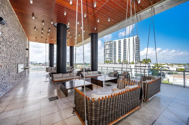 a balcony with furniture and city view