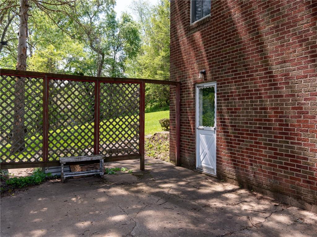 128 Clover Drive Monaca, PA 15061 - Photo 18 of 19 a view of a bench next to a yard