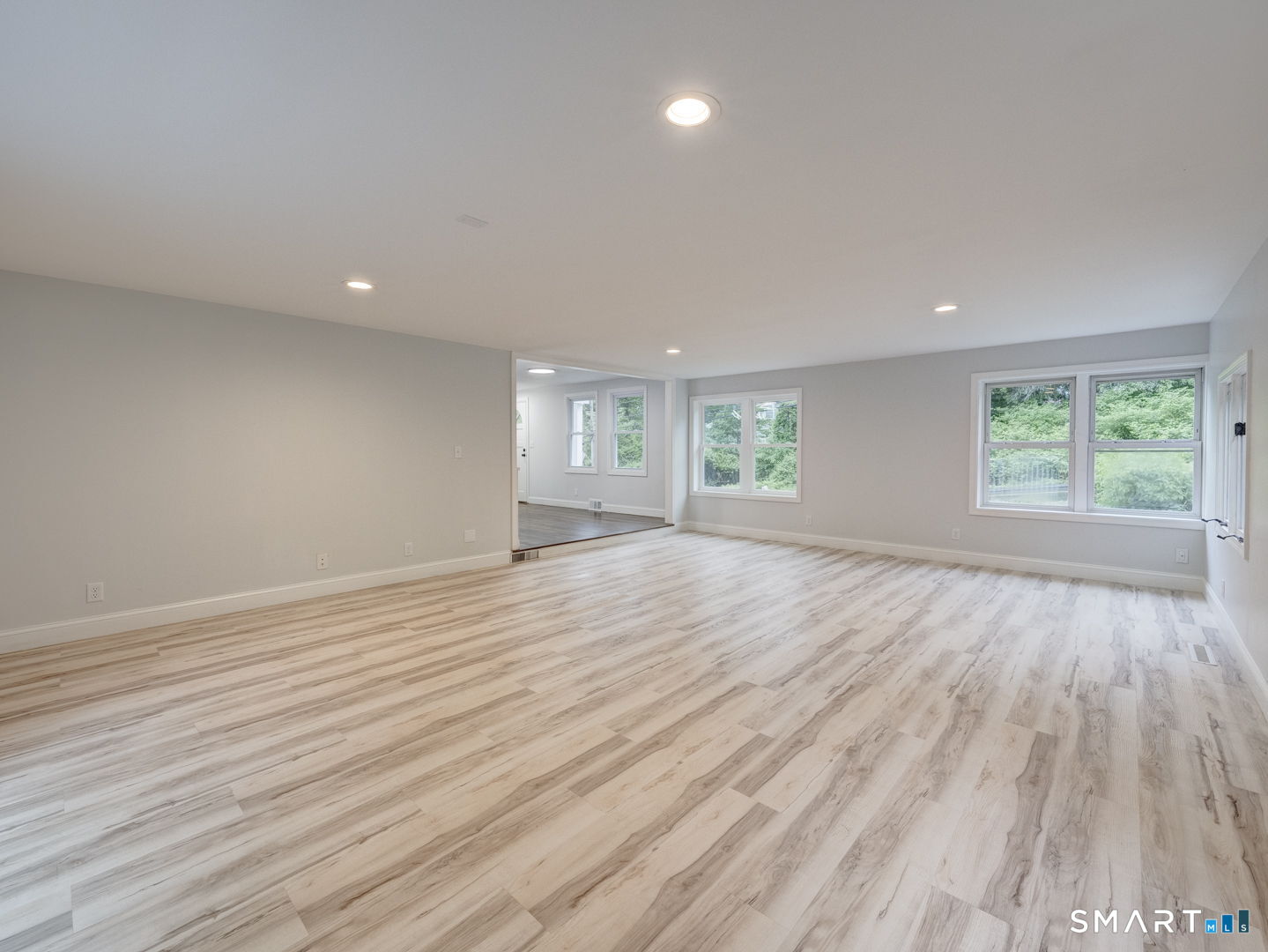 11 Cheshire Road Prospect, CT 06712 - Photo 10 of 38 an empty room with wooden floor and windows