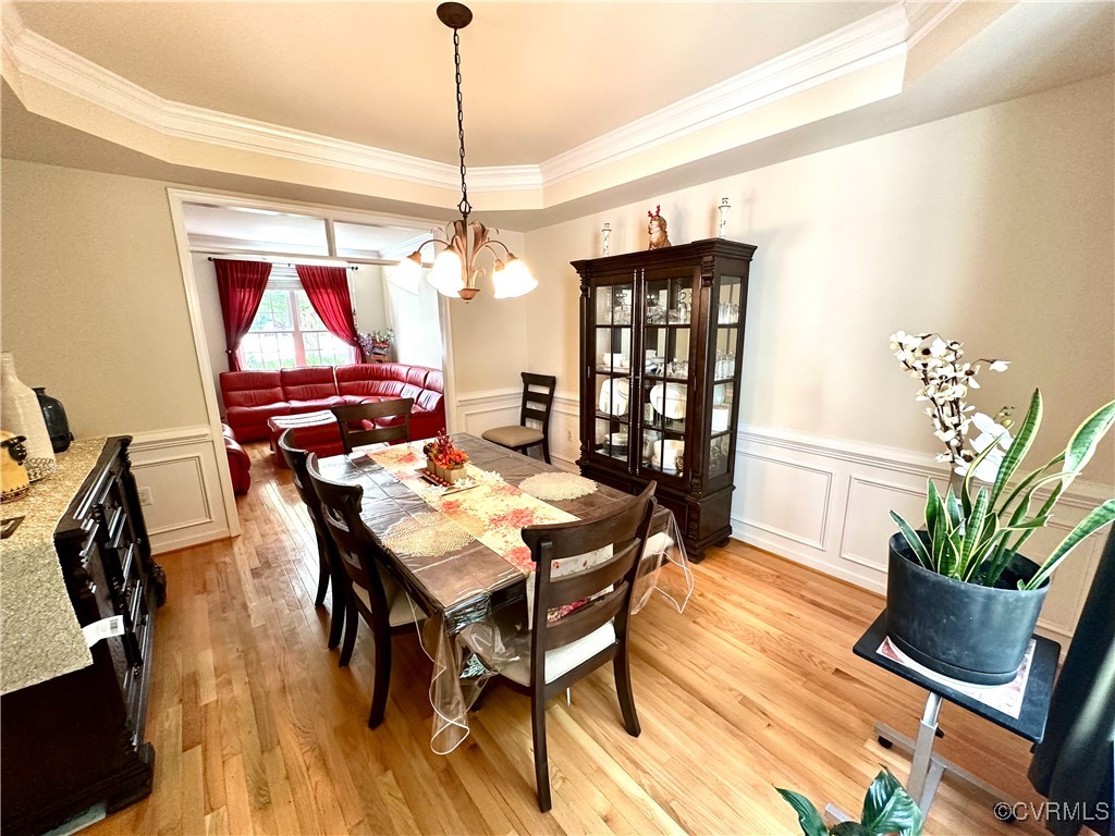 862 Club Ridge Court Chester, VA 23836 - Photo 11 of 50 Dining space with a notable chandelier, a raised c