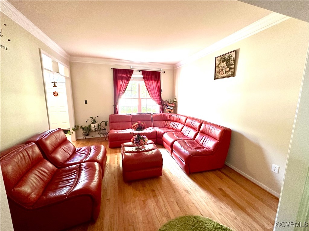 862 Club Ridge Court Chester, VA 23836 - Photo 10 of 50 Living room featuring crown molding and wood-type