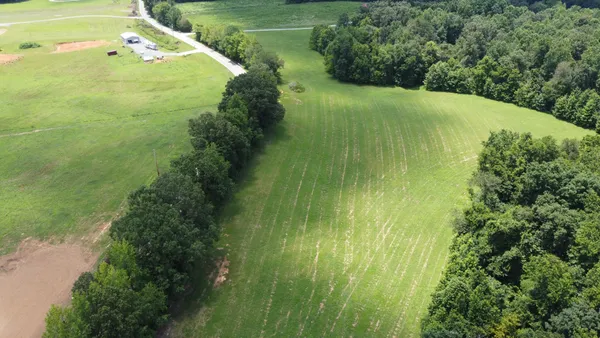 a view of a garden with a building