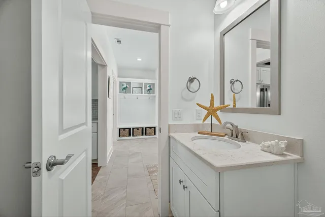 a kitchen with stainless steel appliances a refrigerator and a refrigerator