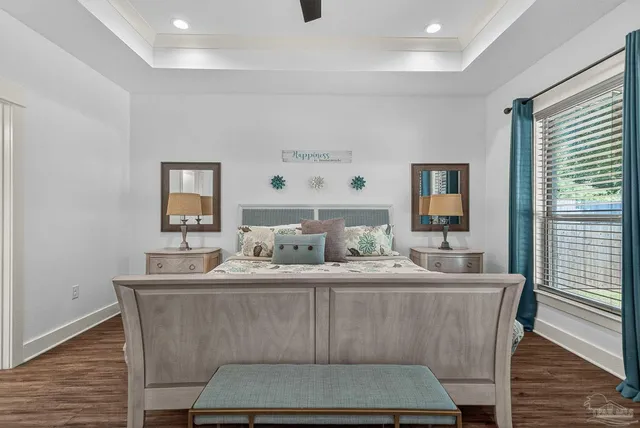 a en suite bathroom with a tub sink and mirror