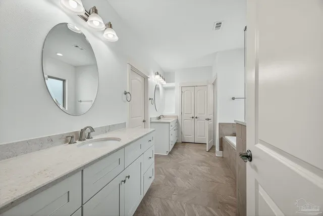 a bathroom with a sink a toilet and shower curtain