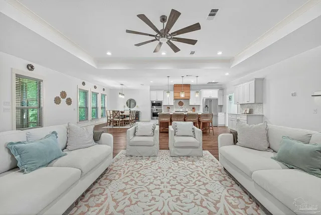 a bathroom with a granite countertop sink a toilet and a mirror
