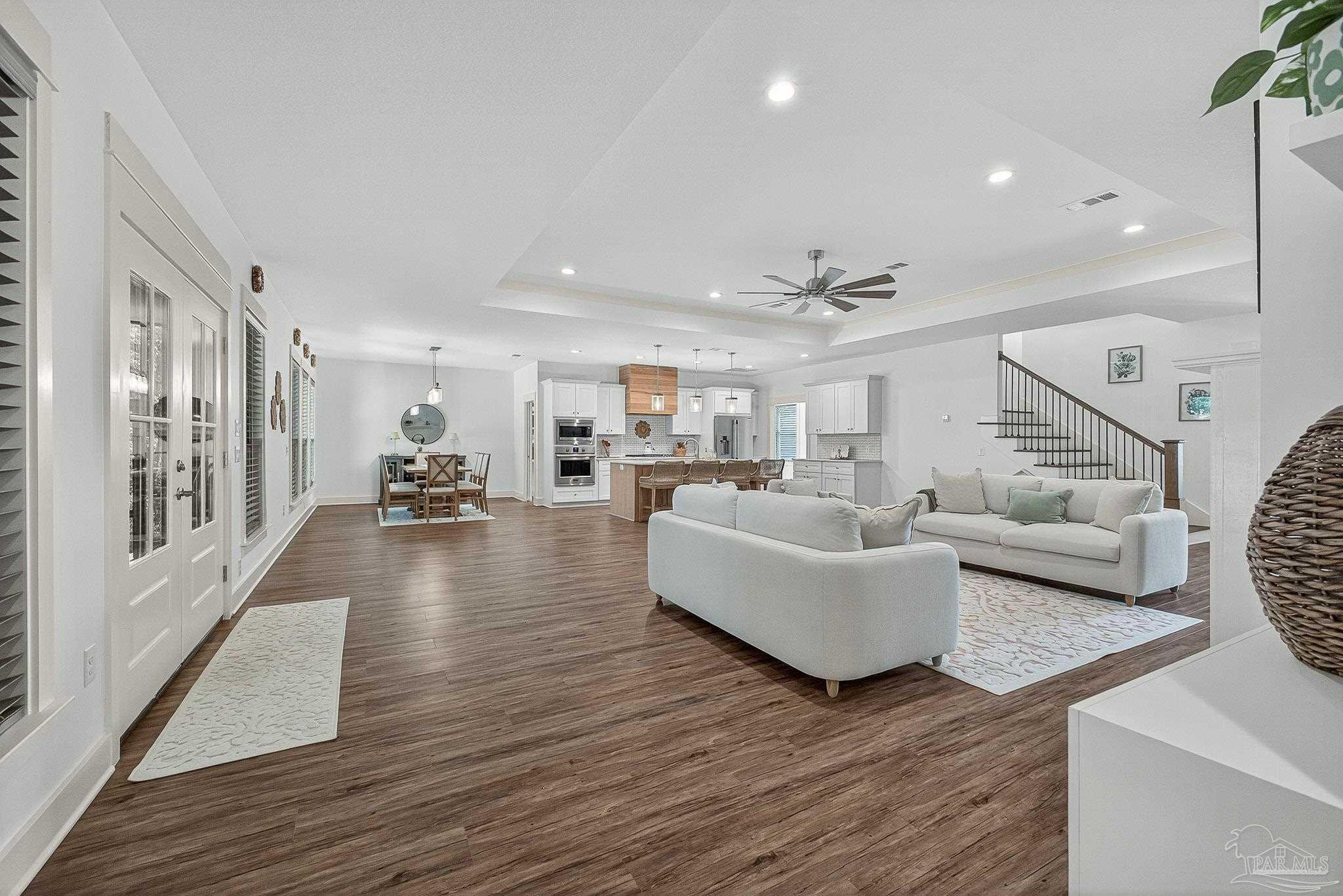 2480 Carthage Court Cantonment, FL 32533 - Photo 10 of 59 a living room with furniture and a wooden floor