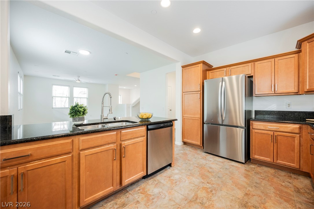 4650 Ranch House Road, Unit 64 North Las Vegas, NV 89031 - Photo 21 of 39 This kitchen showcases a modern aesthetic with stainless steel appliances and ample counter space.