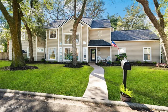 a front view of a house with garden