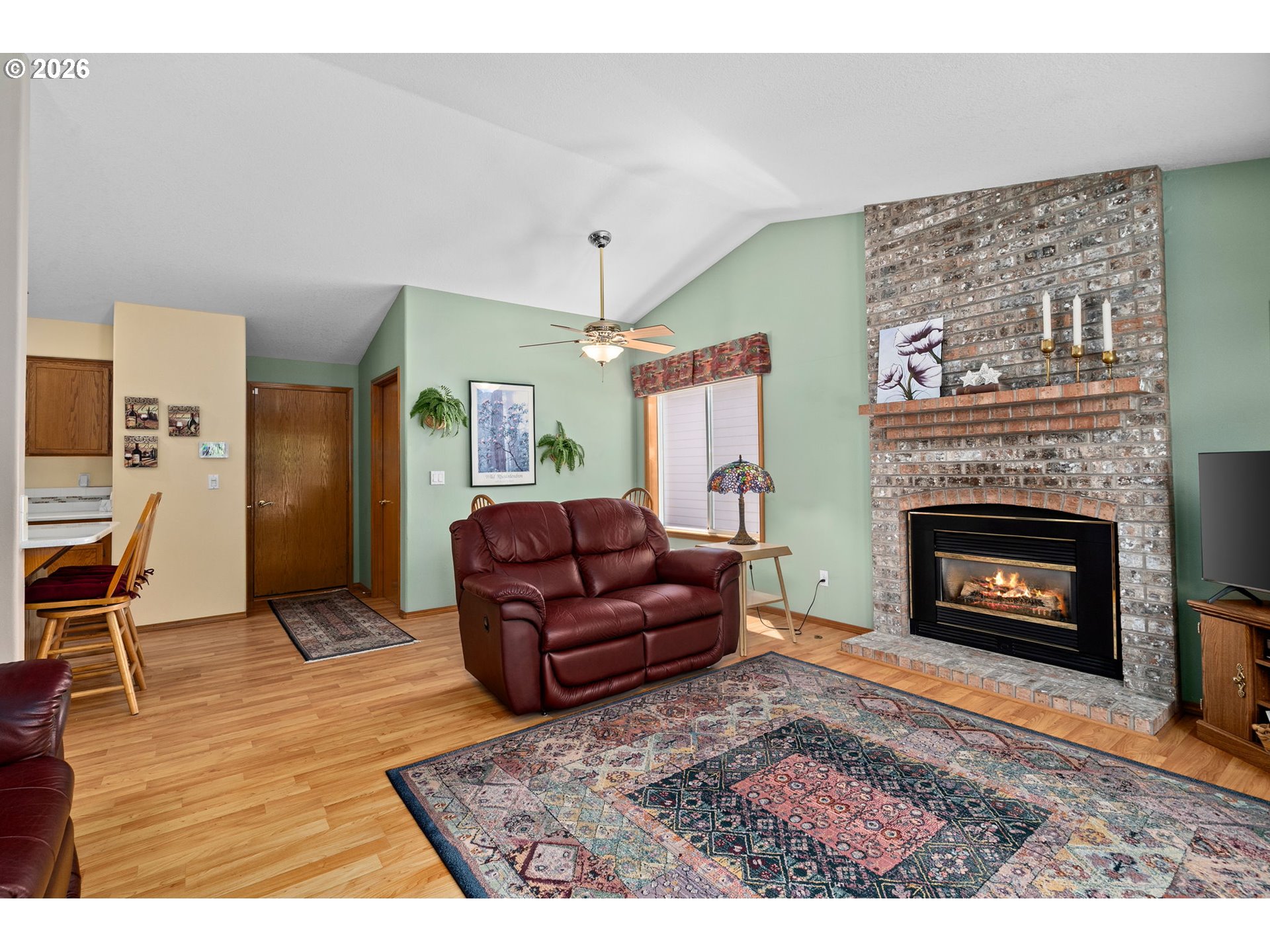 3081 Southwest 31st Street Gresham, OR 97080 - Photo 31 of 38 a living room with furniture and a fireplace
