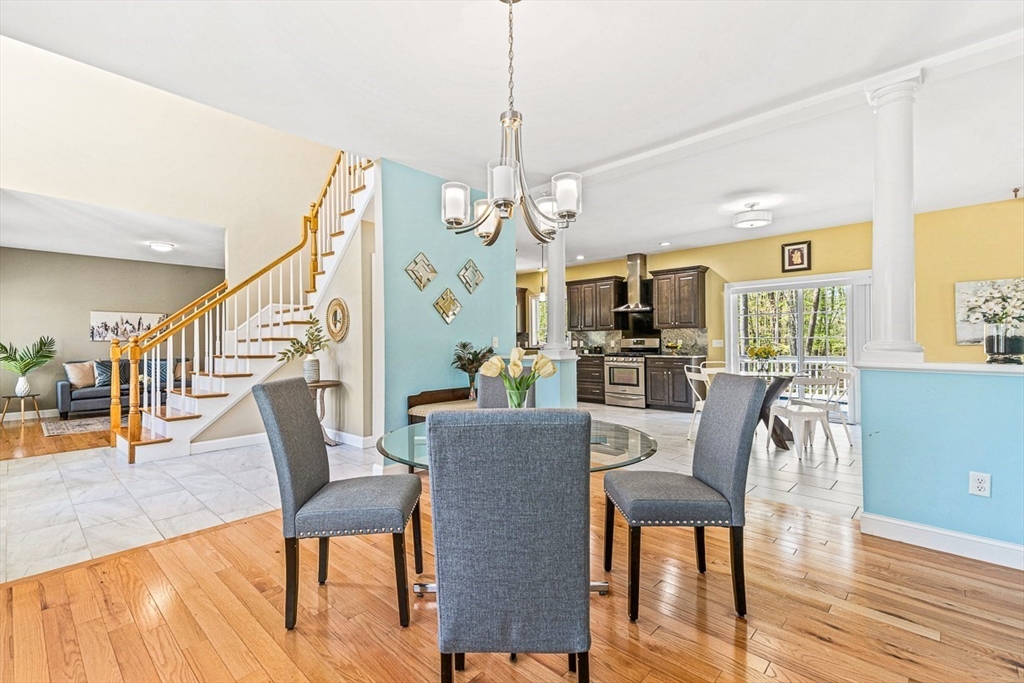 96 Clement Road Dracut, MA 01826 - Photo 11 of 41 a view of a dining room with furniture window and wooden floor