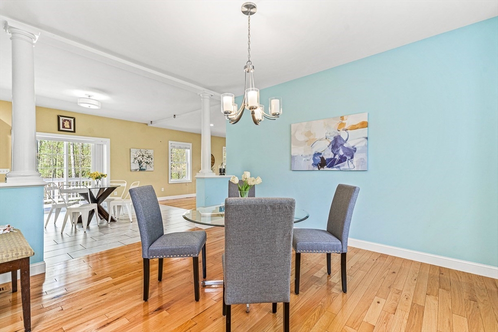 96 Clement Road Dracut, MA 01826 - Photo 12 of 41 a view of a dining room with furniture window and wooden floor