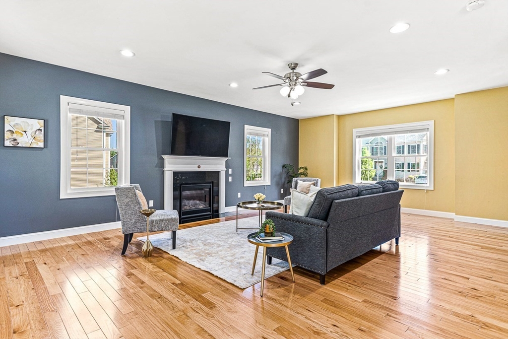 96 Clement Road Dracut, MA 01826 - Photo 14 of 41 a living room with furniture flat screen tv and a fireplace