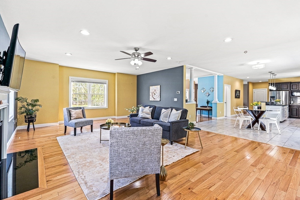96 Clement Road Dracut, MA 01826 - Photo 15 of 41 a living room with furniture and wooden floor