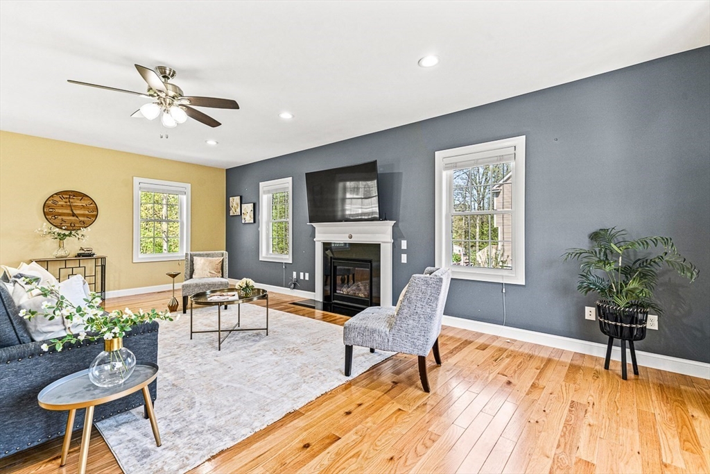 96 Clement Road Dracut, MA 01826 - Photo 17 of 41 a living room with furniture and a fireplace