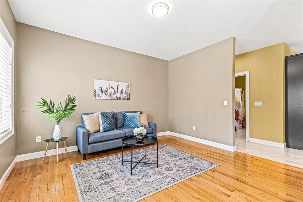 96 Clement Road Dracut, MA 01826 - Photo 18 of 41 a living room with furniture and wooden floor