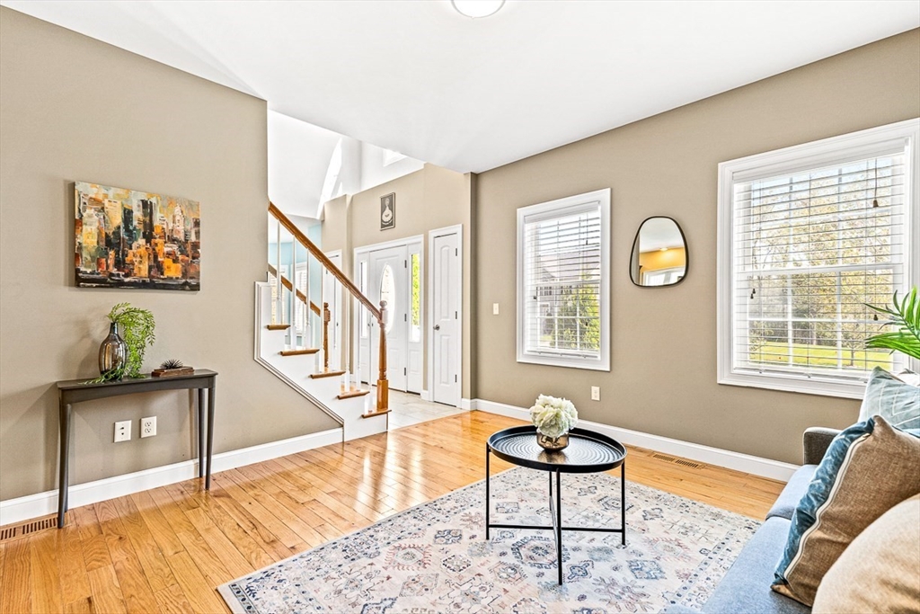 96 Clement Road Dracut, MA 01826 - Photo 20 of 41 a living room with furniture and a wooden floor