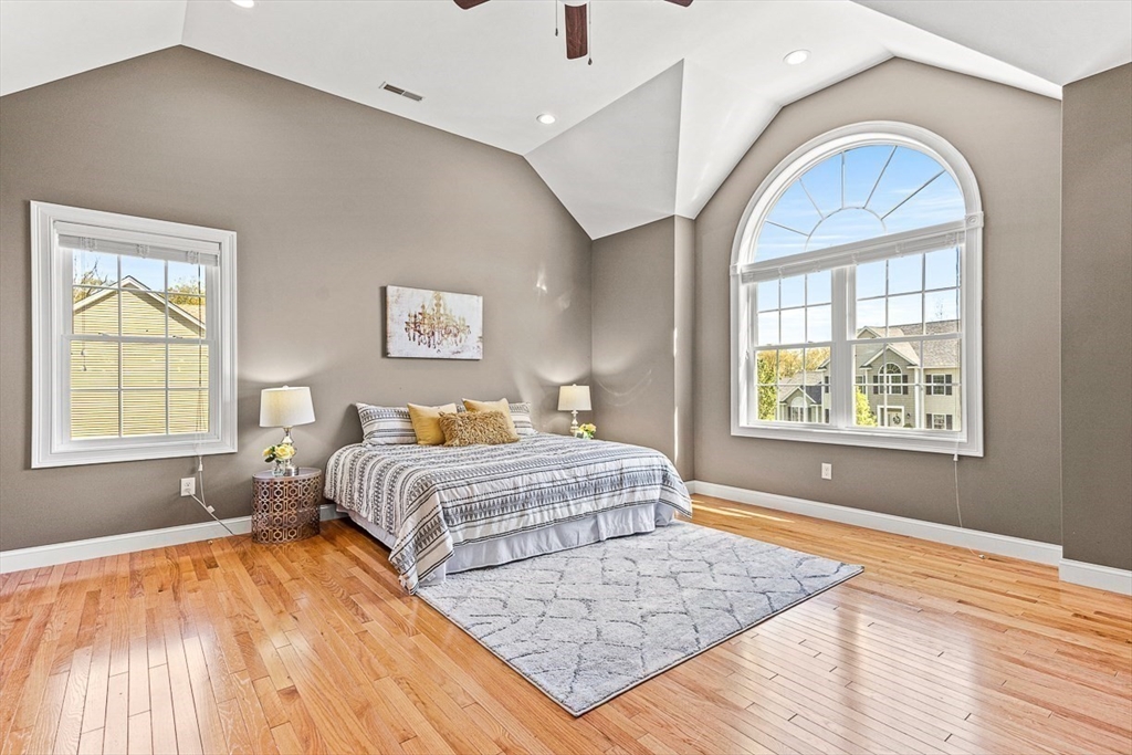 96 Clement Road Dracut, MA 01826 - Photo 23 of 41 a spacious bedroom with a bed and a window