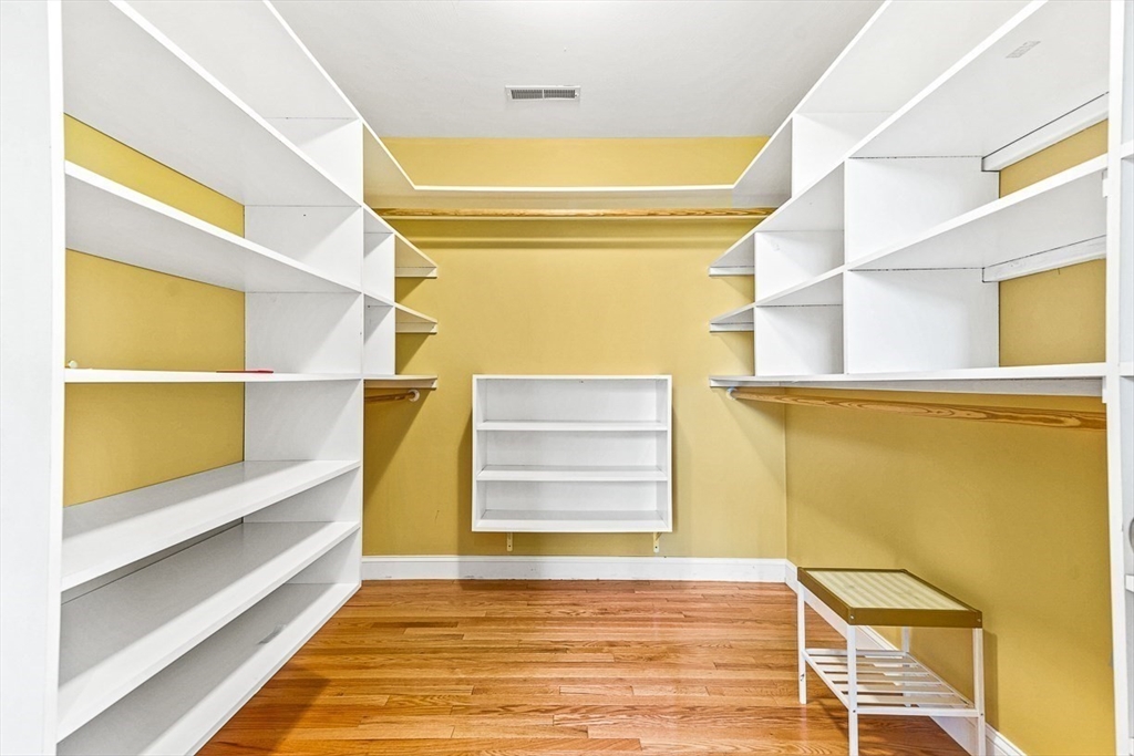 96 Clement Road Dracut, MA 01826 - Photo 26 of 41 a view of walk in closet with empty racks