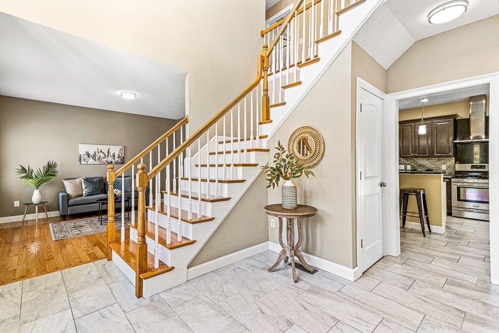 96 Clement Road Dracut, MA 01826 - Photo 3 of 41 a view of entryway and hall with dining room