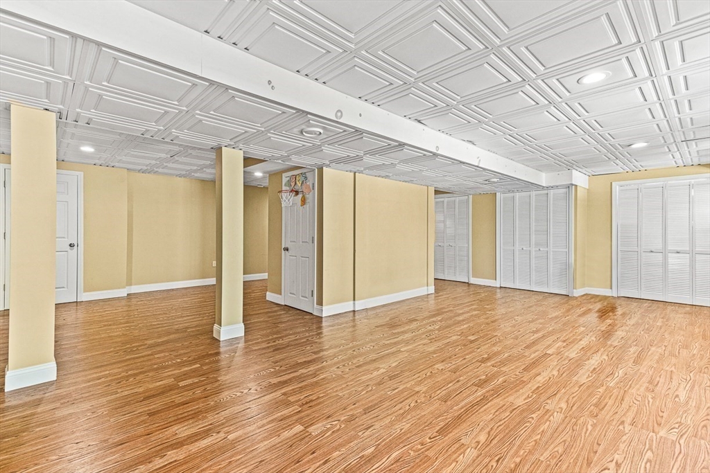 96 Clement Road Dracut, MA 01826 - Photo 34 of 41 a view of an empty room with wooden floor