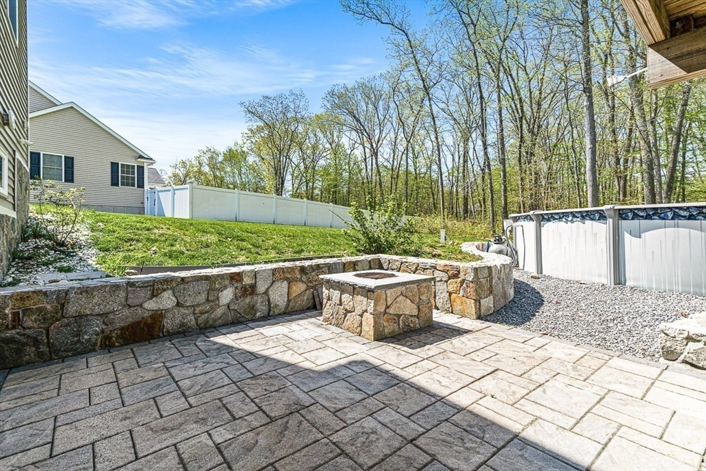 96 Clement Road Dracut, MA 01826 - Photo 36 of 41 a view of a backyard with sitting area