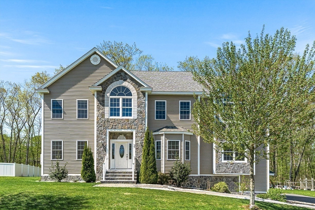 96 Clement Road Dracut, MA 01826 - Photo 40 of 41 a front view of a house with a yard