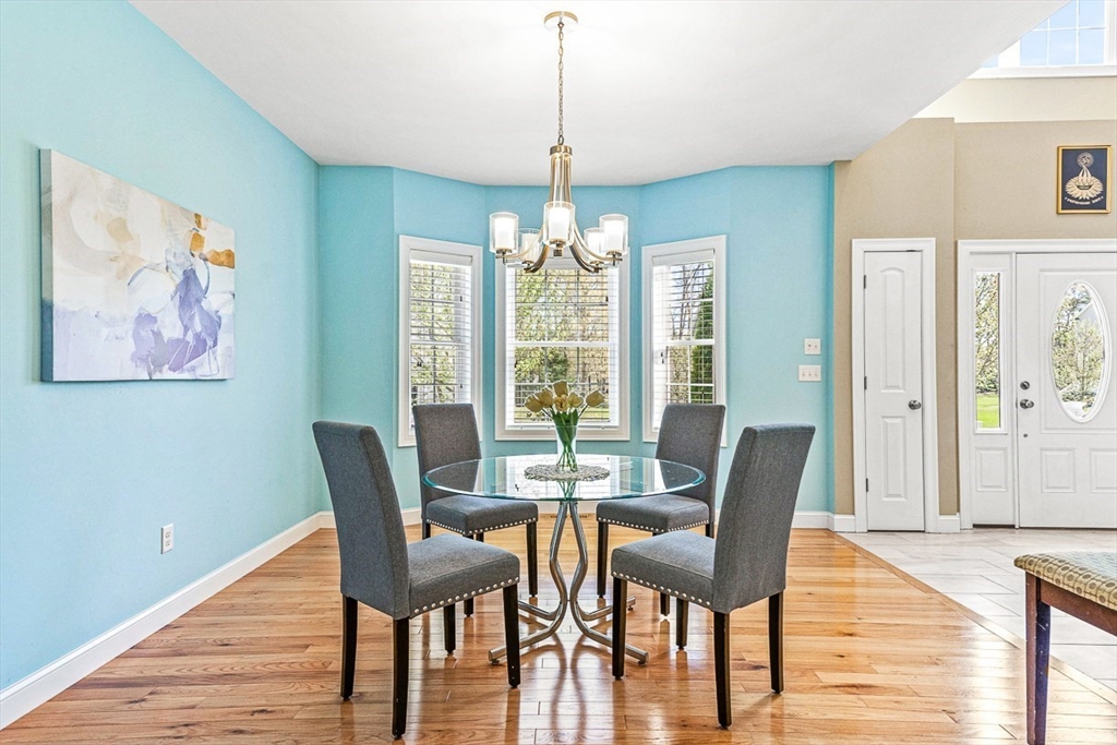 96 Clement Road Dracut, MA 01826 - Photo 10 of 41 a view of a dining room with furniture window and wooden floor