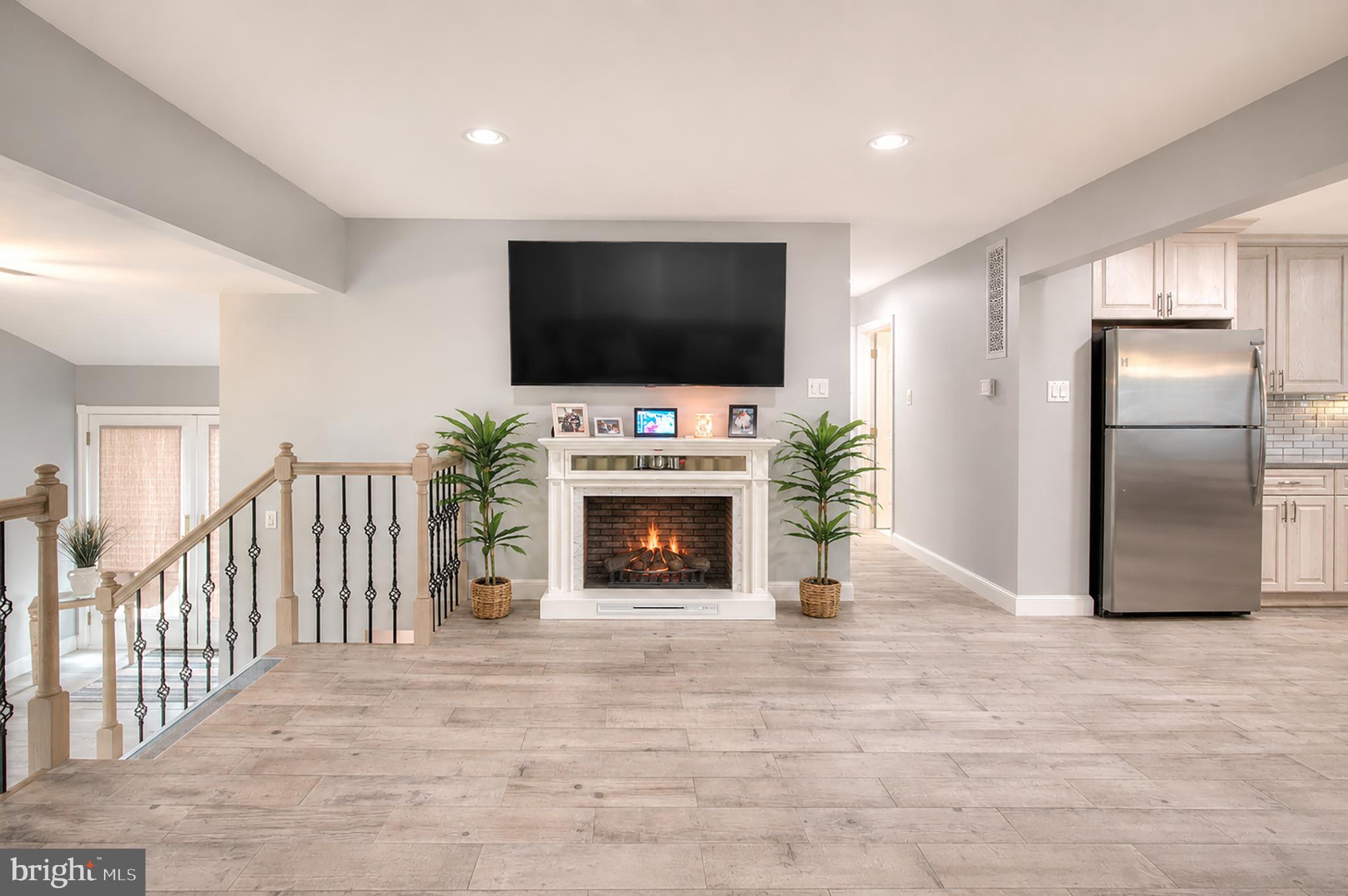 32 Bryant Road Turnersville, NJ 08012 - Photo 5 of 33 a living room with fireplace furniture and a flat screen tv