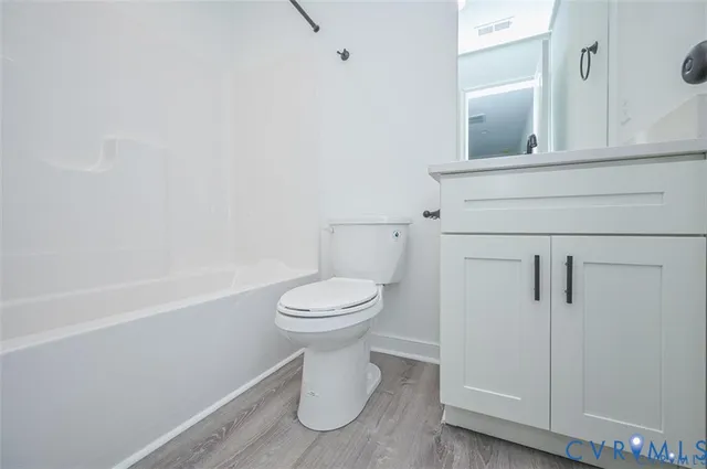 a bathroom with a toilet and a bathtub