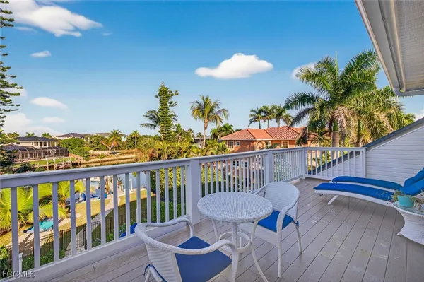 a view of a balcony with wooden floor