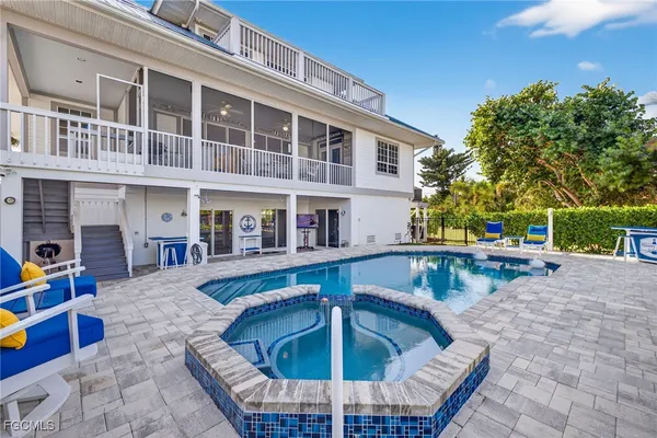 a view of pool with outdoor seating