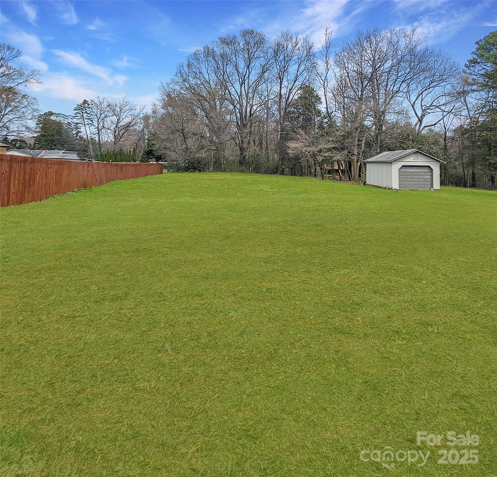 604 Touch Me Not Lane Charlotte, NC 28216 - Photo 3 of 6 a view of a field of grass and trees