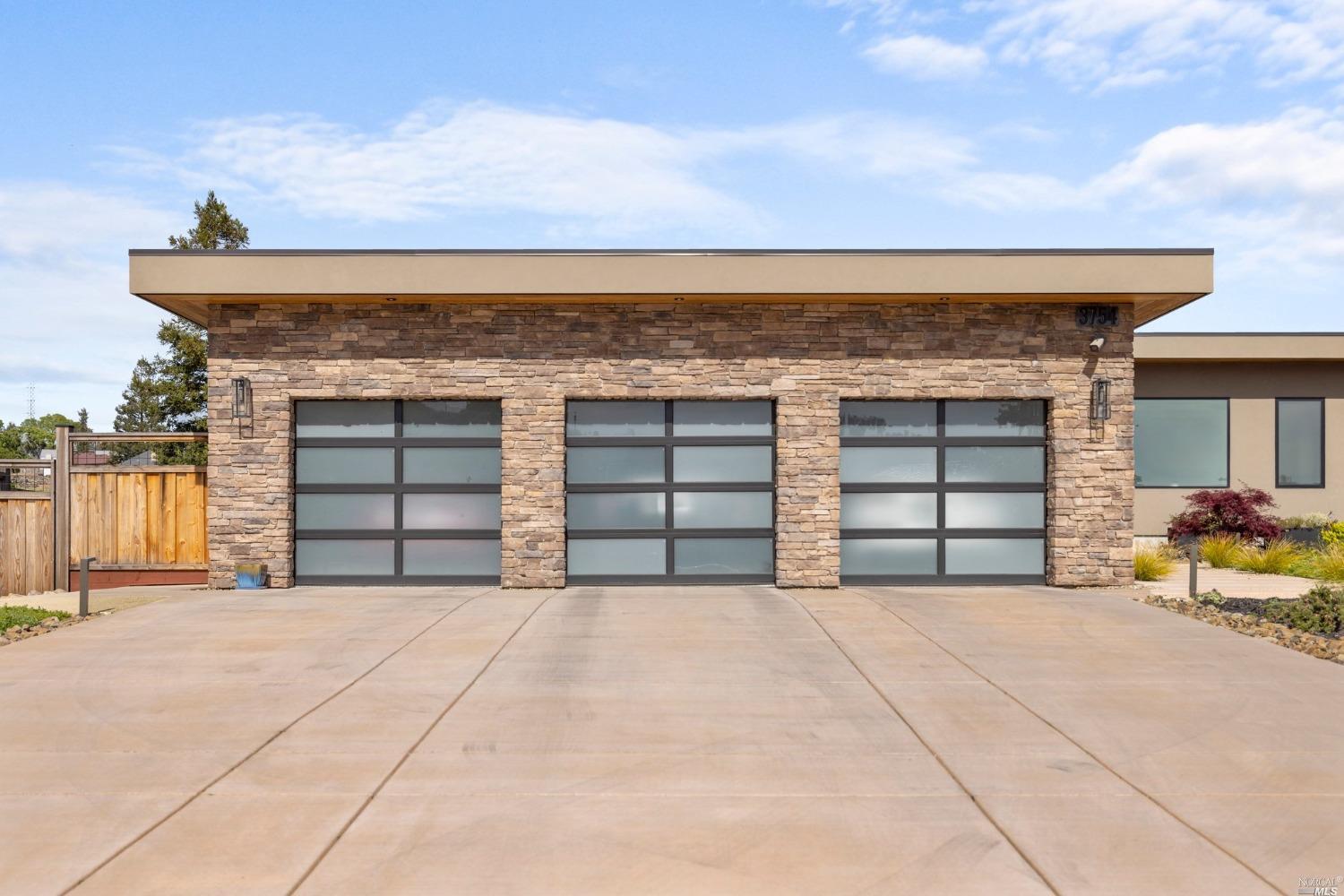 3754 St Andrews Drive Santa Rosa, CA 95403 - Photo 31 of 37 755 sq. ft. 3-car garage with epoxy floors, EV charging station and storage area.