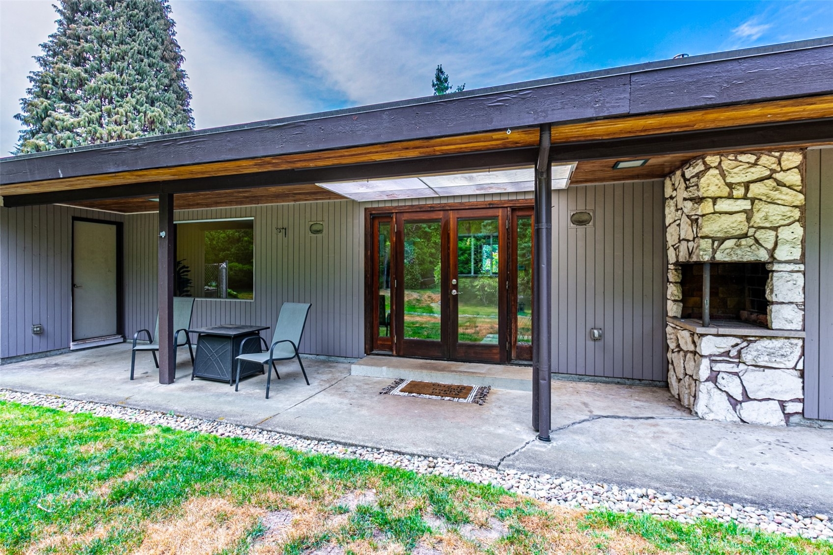 20462 98th Place South Kent, WA 98031 - Photo 21 of 31 a front view of a house with outdoor seating and a potted plant