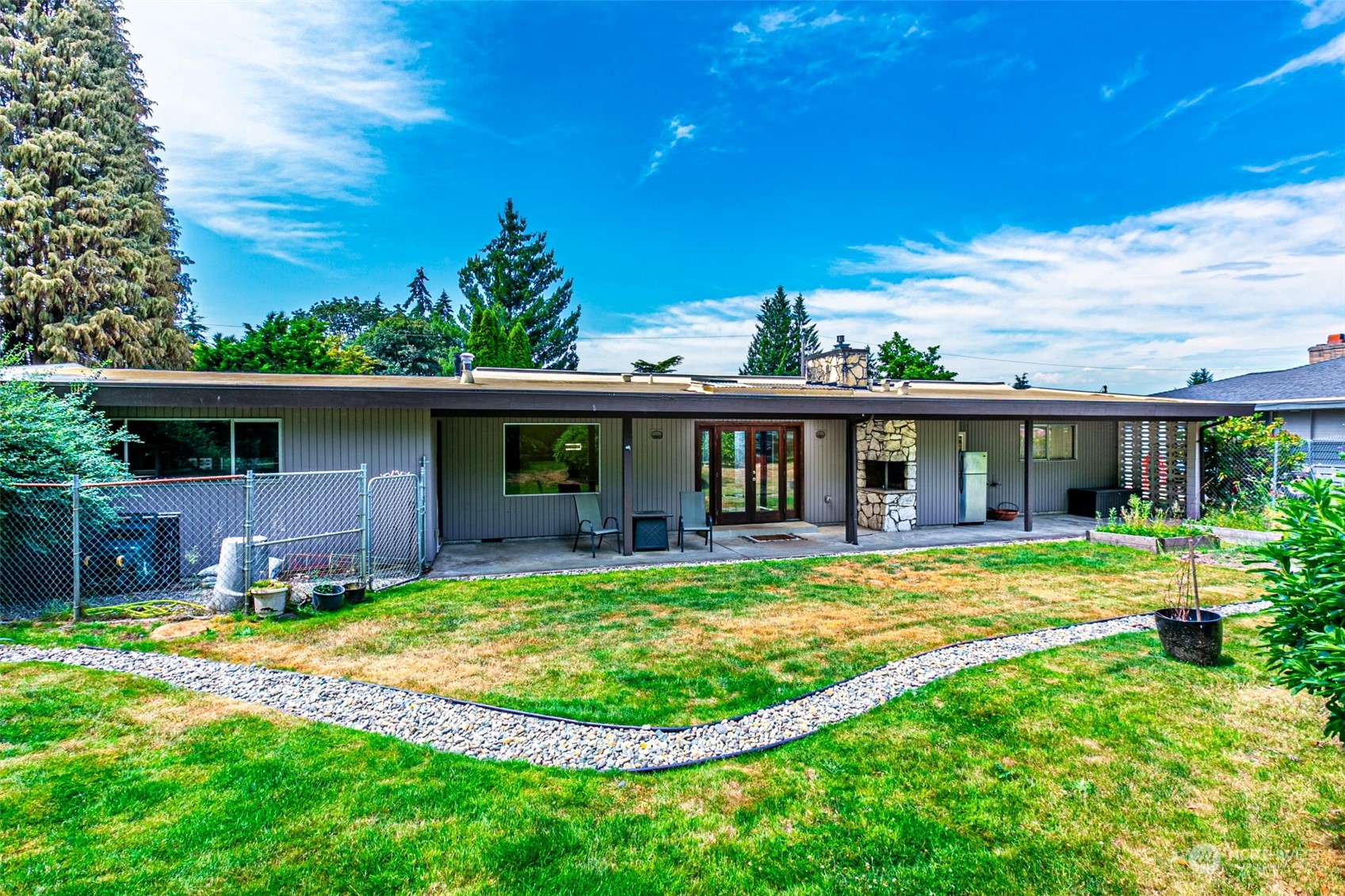 20462 98th Place South Kent, WA 98031 - Photo 22 of 31 a view of a house with a swimming pool and a yard
