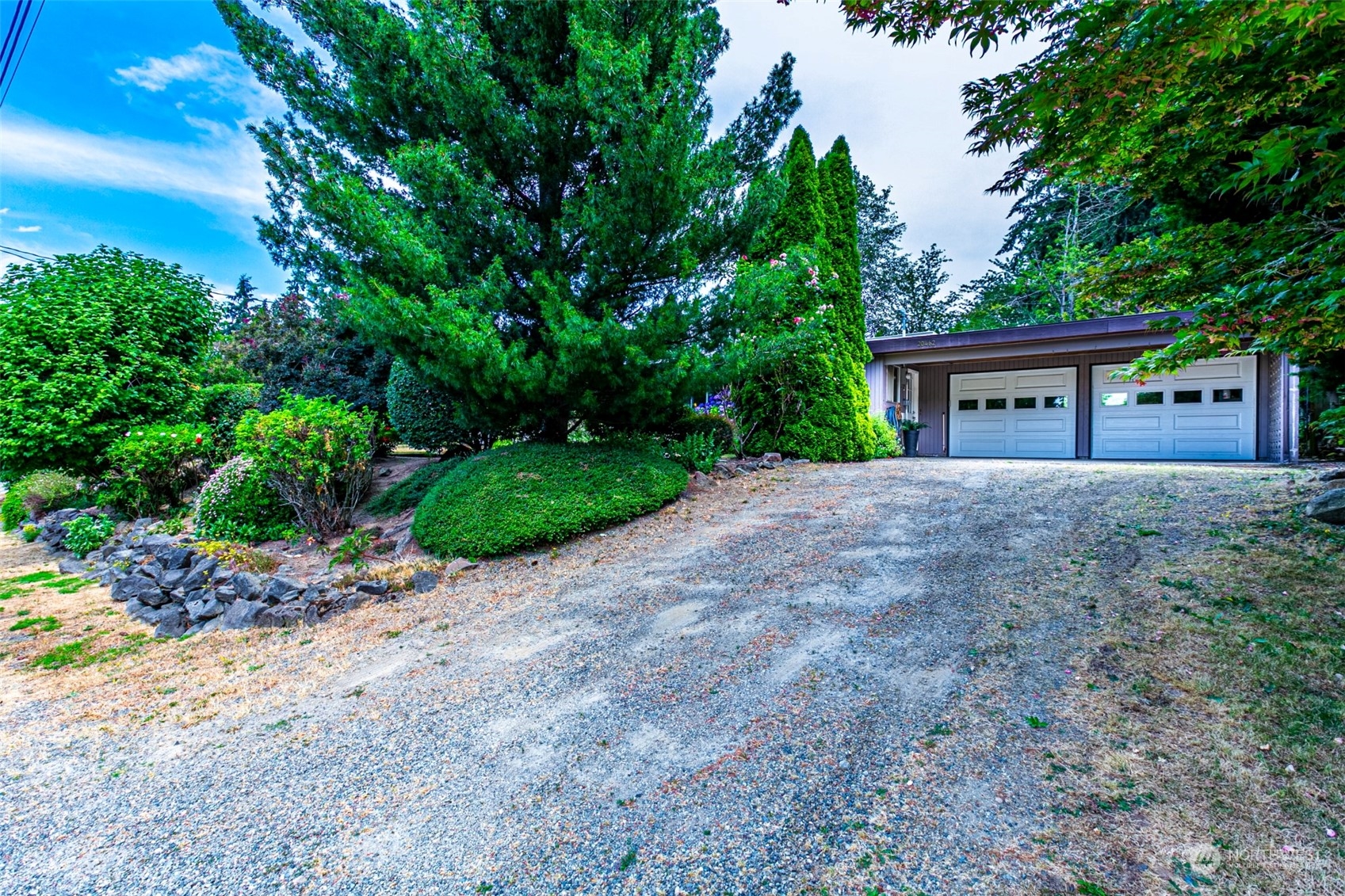 20462 98th Place South Kent, WA 98031 - Photo 30 of 31 a front view of a house with a garden and yard