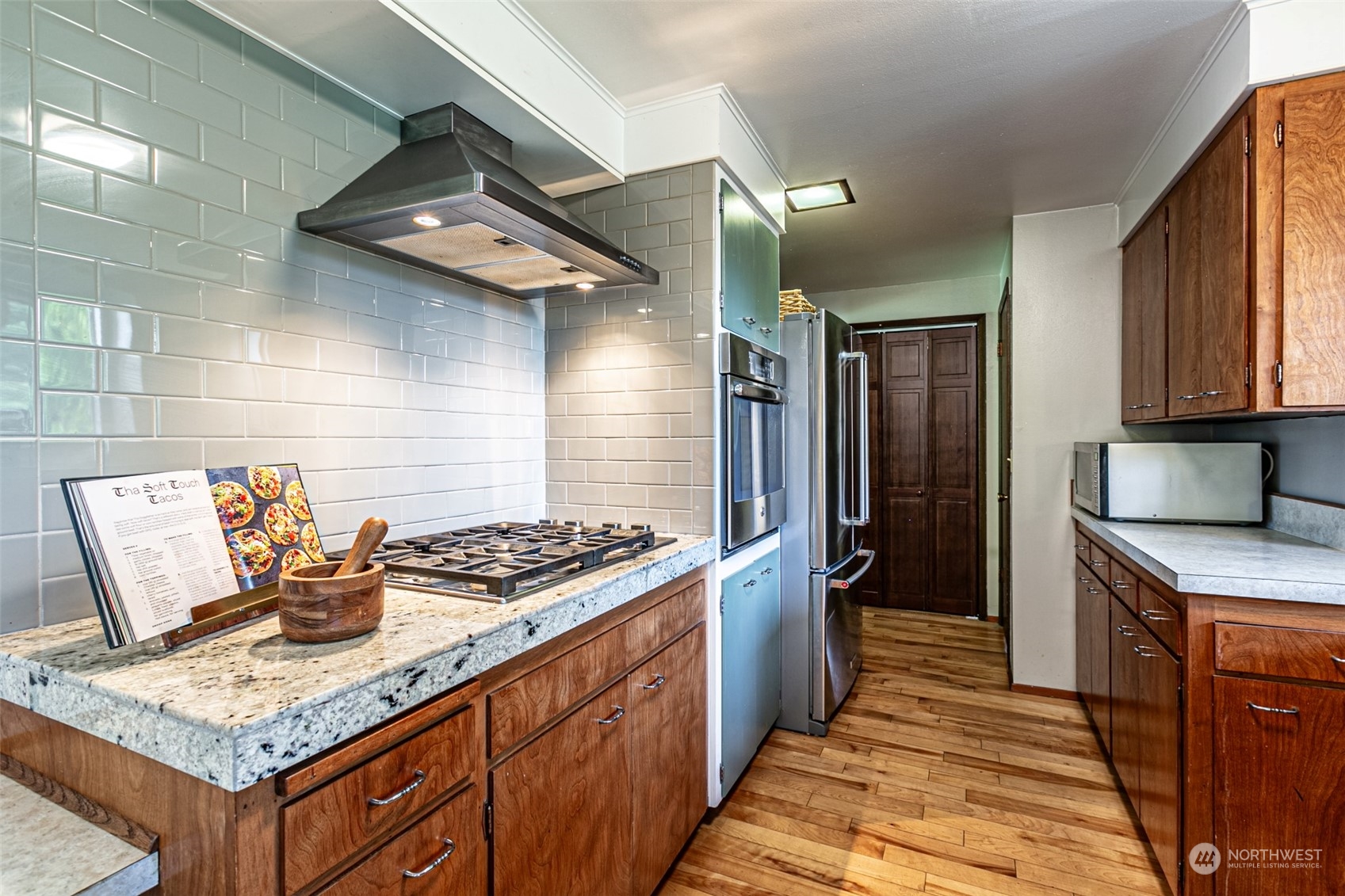 20462 98th Place South Kent, WA 98031 - Photo 5 of 31 a kitchen with stainless steel appliances granite countertop a sink stove and refrigerator