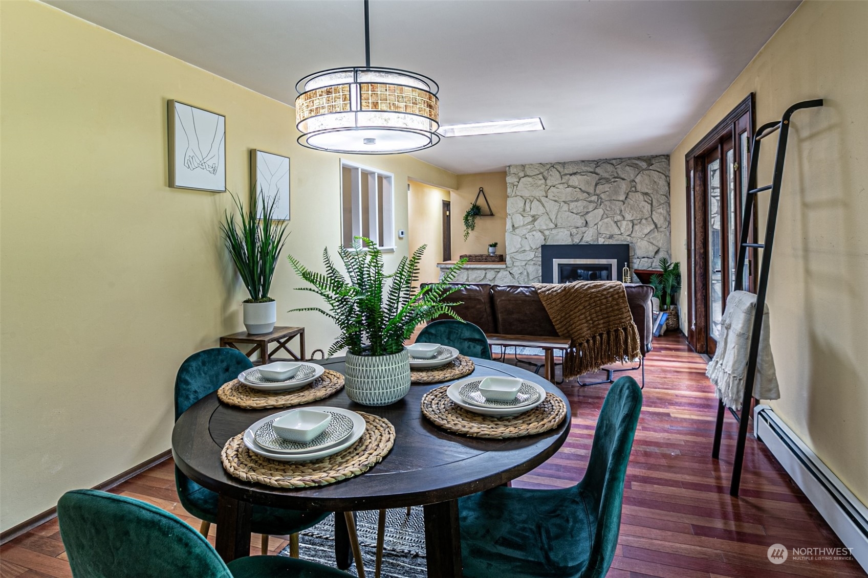 20462 98th Place South Kent, WA 98031 - Photo 6 of 31 a view of a dining room with furniture a chandelier and wooden floor