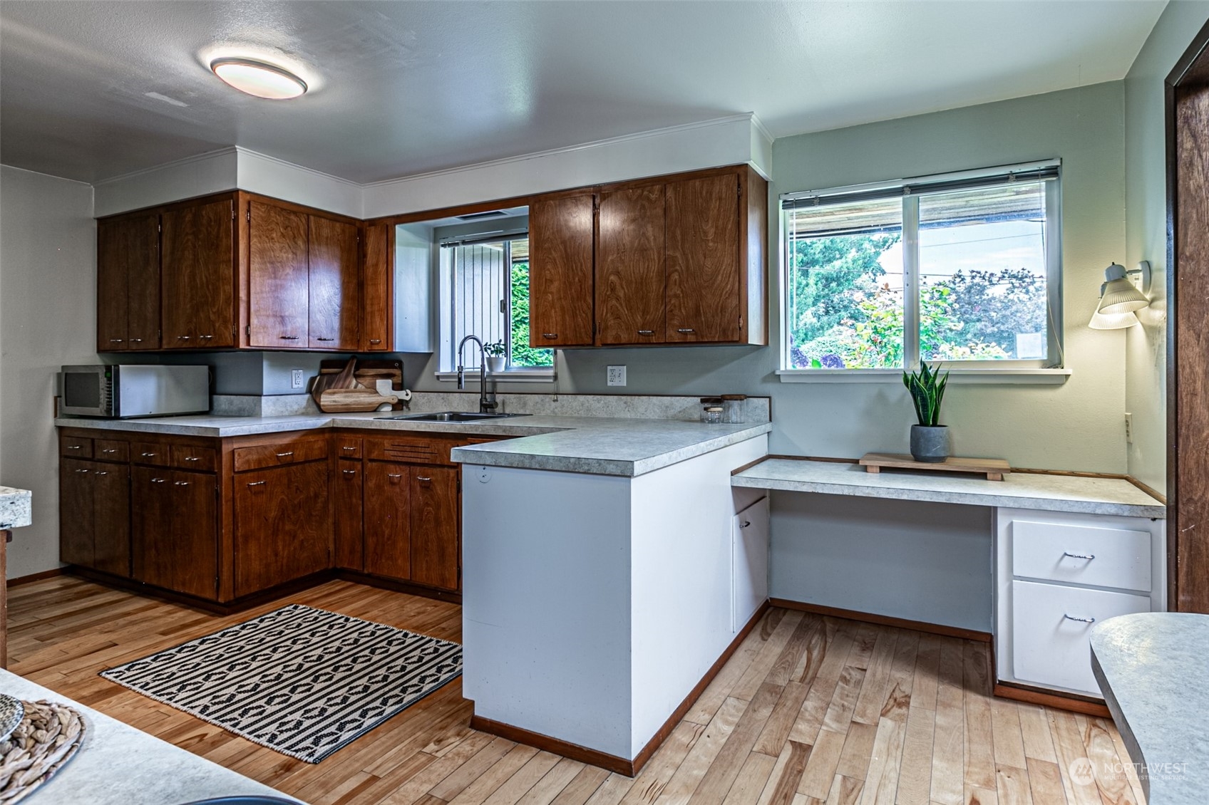 20462 98th Place South Kent, WA 98031 - Photo 7 of 31 a kitchen with a sink stove and cabinets