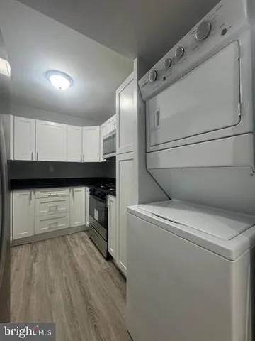 a kitchen with a refrigerator and a stove