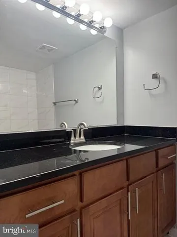 a close view of sink and cabinets